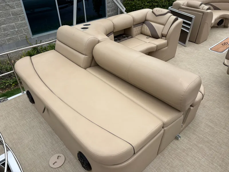 Slide: The Image of The image shows beige leather seating on a 2019 Harris Sunliner 230 pontoon boat. - 9