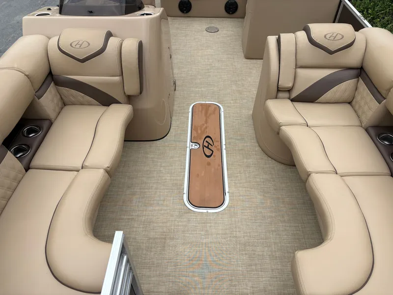 Slide: The Image of Interior of a 2019 Harris Sunliner 230 with beige upholstery and carpeted flooring. - 17