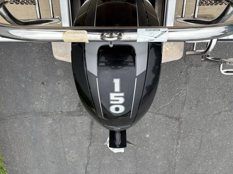 Slide: The Image of Outboard motor labeled "150" on a Harris Sunliner 230 pontoon boat. - 6