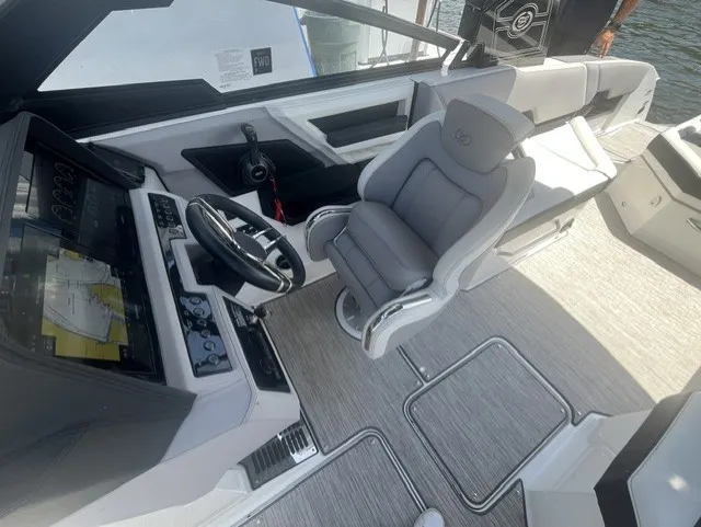 Slide: The Image of The image shows the cockpit of a 2022 Cobalt R8 Surf boat with a luxurious seat. - 15