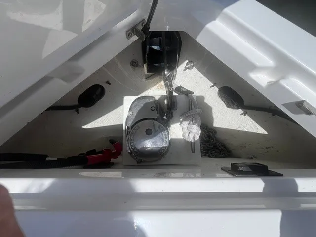 Slide: The Image of The anchor locker of a 2022 Cobalt R8 Surf with chain and windlass. - 20