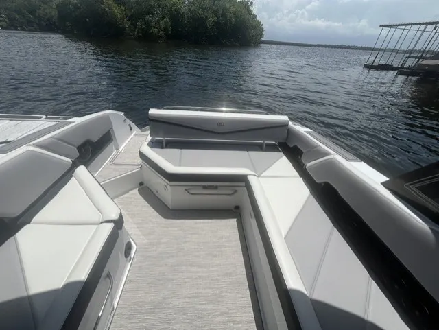 Slide: The Image of The image shows the cockpit of a 2022 Cobalt R8 Surf boat with gray upholstery. - 7