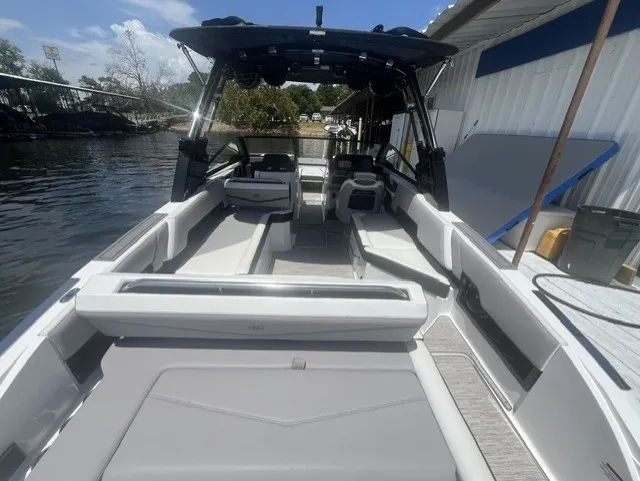 Slide: The Image of The image shows a modern 2022 Cobalt R8 Surf boat with a stylish, spacious interior. - 9