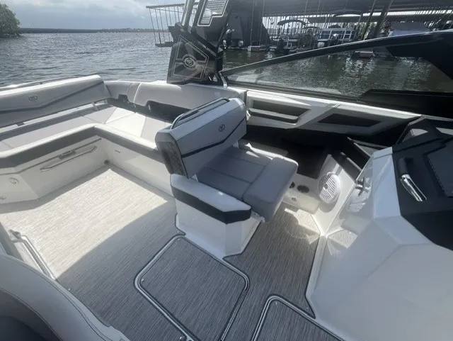 Slide: The Image of The image shows the interior of a 2022 Cobalt R8 Surf boat with sleek seating. - 13