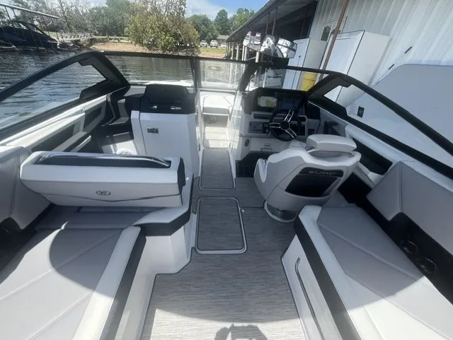 Slide: The Image of The image shows the cockpit of a 2022 Cobalt R8 Surf boat with modern seating and controls. - 10