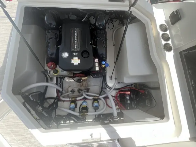 Slide: The Image of The engine compartment of a 2022 Cobalt R8 Surf shows a neatly installed engine with hoses and cables. - 8