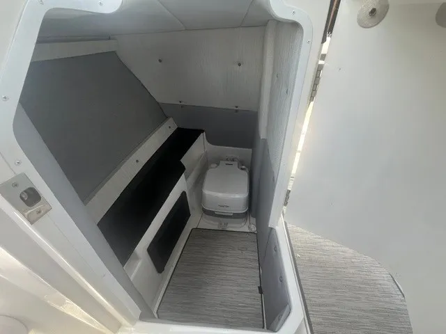 Slide: The Image of Interior of the 2022 Cobalt R8 Surf with gray walls and a small toilet. - 14