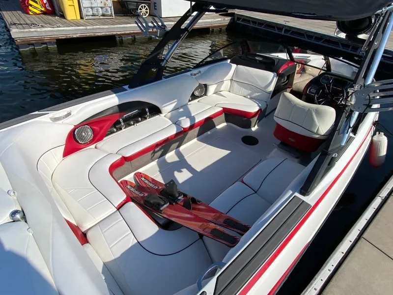 Slide: The Image of The image shows the interior of a 2012 Malibu 247 LSV with white and red seating. - 5