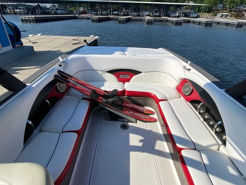 Slide: The Image of The image shows the interior of a 2012 Malibu 247 LSV with white and red seating. - 7