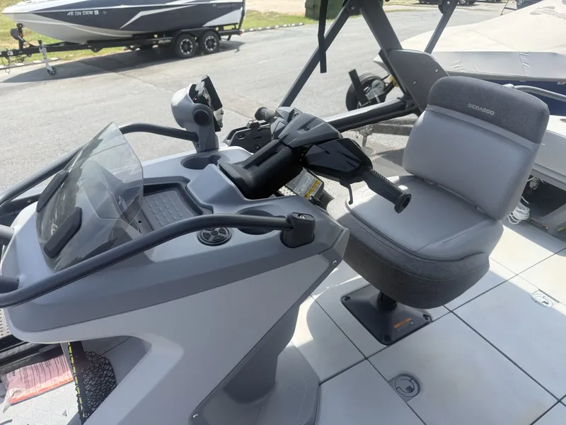 Slide: The Image of The image shows the helm of a 2023 Sea-Doo Switch Cruise with a gray seat. - 12