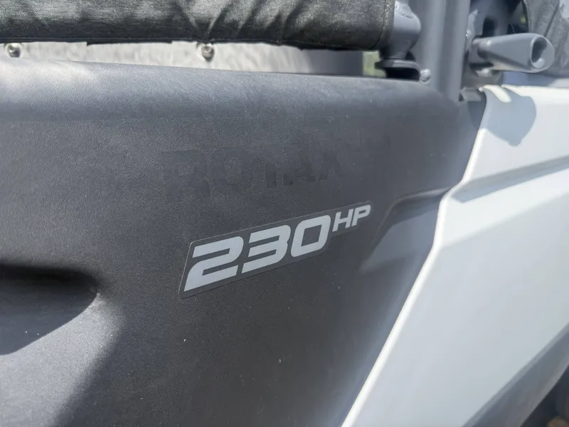 Slide: The Image of Close-up of a Sea-Doo Switch Cruise with 230 HP lettering. - 7