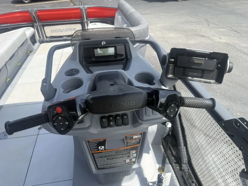 Slide: The Image of The image shows the helm of a 2023 Sea-Doo Switch Cruise with modern controls. - 13