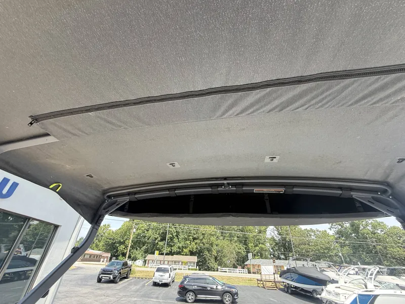 Slide: The Image of The image shows the roof of a 2023 Sea-Doo Switch Cruise with surrounding cars and boats. - 15
