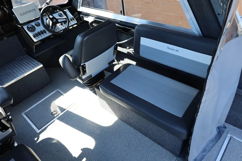 Slide: The Image of 2025 Thunder Jet 200 Luxor boat interior with Garmin navigation and comfortable seating. - 37