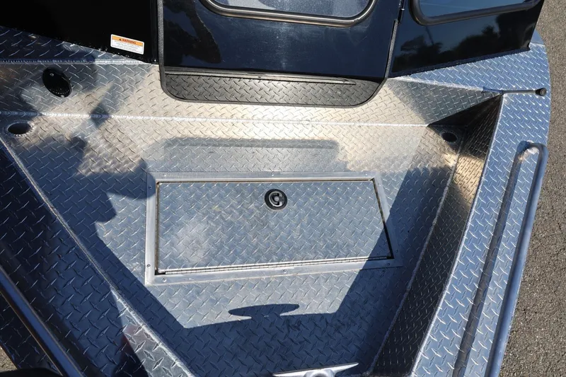 Slide: The Image of Diamond plate deck of 2025 Thunder Jet 200 Luxor boat, featuring storage compartment. - 62