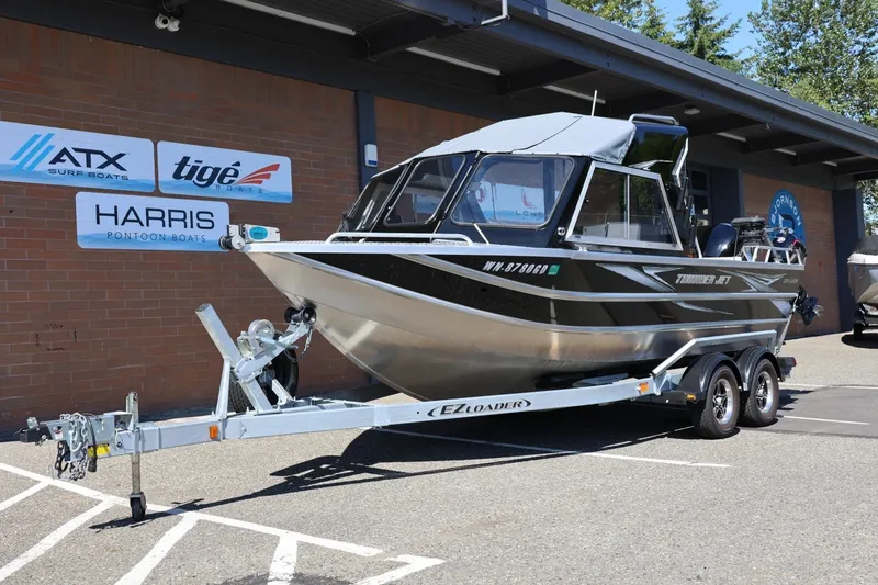 Slide: The Image of 2025 Thunder Jet 200 Luxor boat on trailer outside dealership. - 15