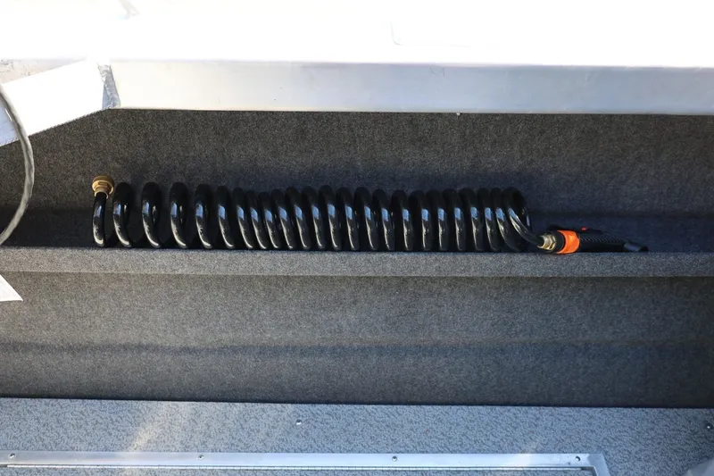 Slide: The Image of Coiled hose in Thunder Jet 200 Luxor boat, 2025 model, interior view. - 31