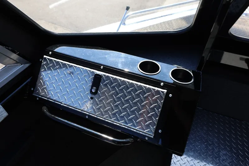 Slide: The Image of Interior of 2025 Thunder Jet 200 Luxor boat with diamond plate storage and cup holders. - 51