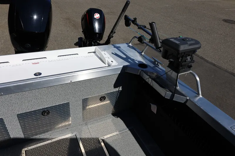 Slide: The Image of 2025 Thunder Jet 200 Luxor boat interior with fishing equipment and dual motors. - 23