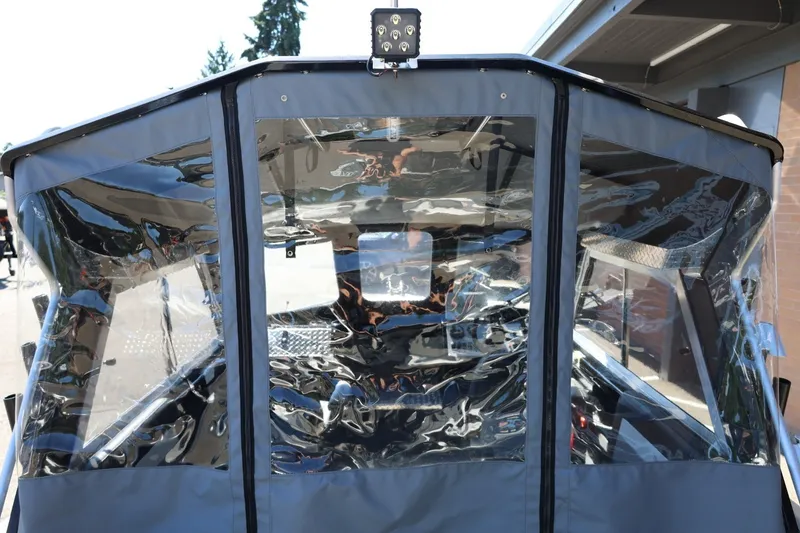 Slide: The Image of 2025 Thunder Jet 200 Luxor boat with clear protective canopy and sturdy frame. - 32