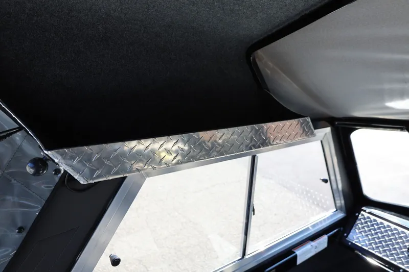 Slide: The Image of Interior view of 2025 Thunder Jet 200 Luxor boat with diamond plate accents. - 39