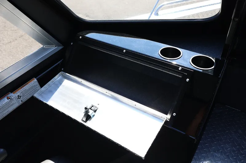 Slide: The Image of Interior of 2025 Thunder Jet 200 Luxor boat with storage compartment and cup holders. - 52