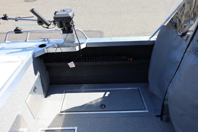 Slide: The Image of 2025 Thunder Jet 200 Luxor boat interior with fishing rod holder and storage compartments. - 22