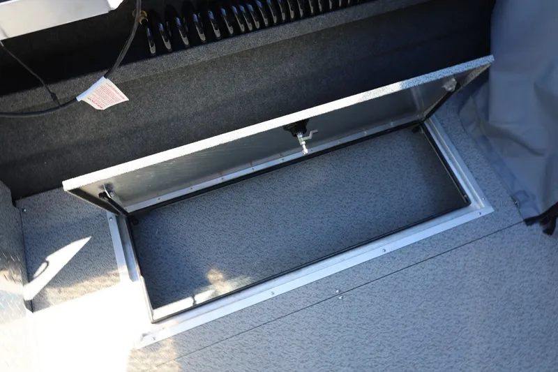Slide: The Image of Open storage compartment in 2025 Thunder Jet 200 Luxor boat interior. - 30