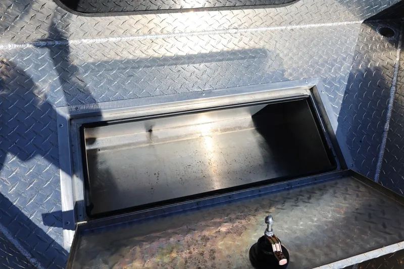 Slide: The Image of Storage compartment on a 2025 Thunder Jet 200 Luxor boat with diamond plate flooring. - 63