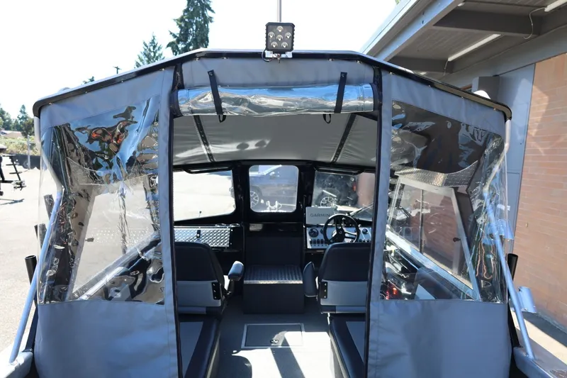 Slide: The Image of Interior view of 2025 Thunder Jet 200 Luxor boat with clear canopy and modern controls. - 33