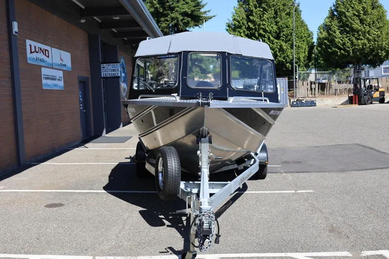Slide: The Image of 2025 Thunder Jet 200 Luxor boat on trailer in parking lot. - 12