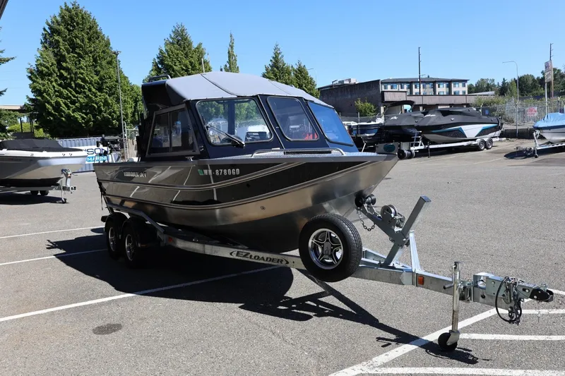 Slide: The Image of 2025 Thunder Jet 200 Luxor boat on trailer in parking lot. - 10