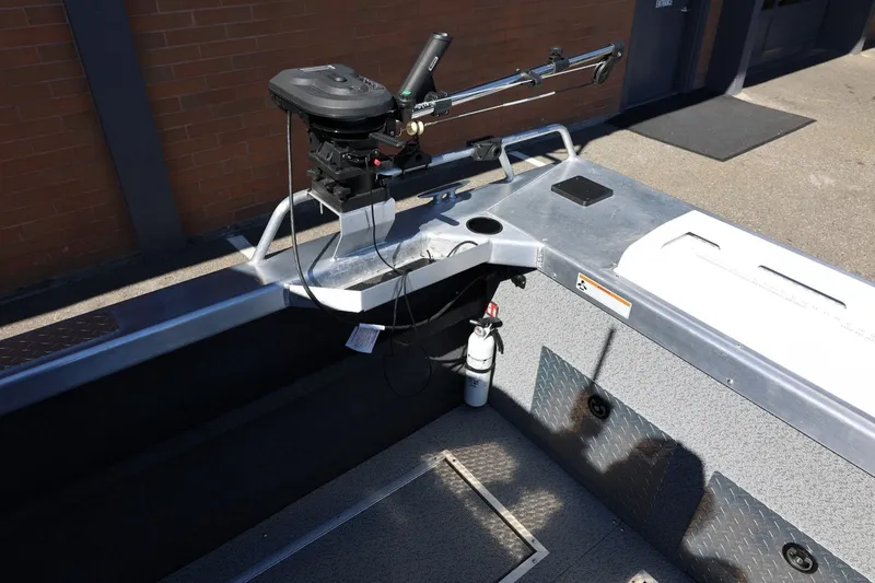 Slide: The Image of Interior of a 2025 Thunder Jet 200 Luxor boat with steering controls and safety equipment. - 25