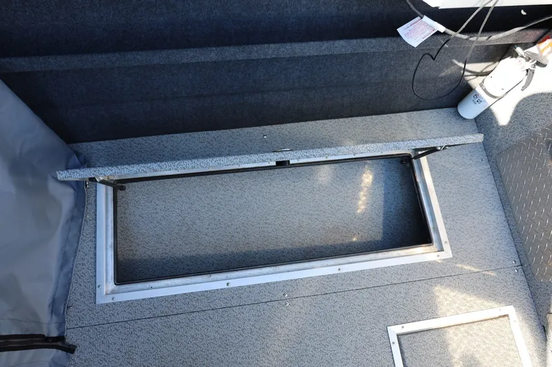 Slide: The Image of Open storage compartment in 2025 Thunder Jet 200 Luxor boat interior. - 29