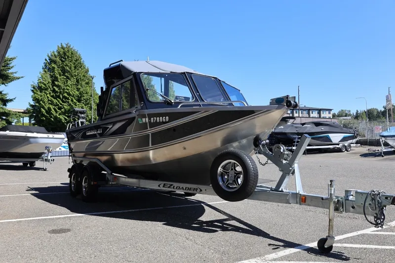 Slide: The Image of 2025 Thunder Jet 200 Luxor boat on trailer in parking lot, sunny day. - 11