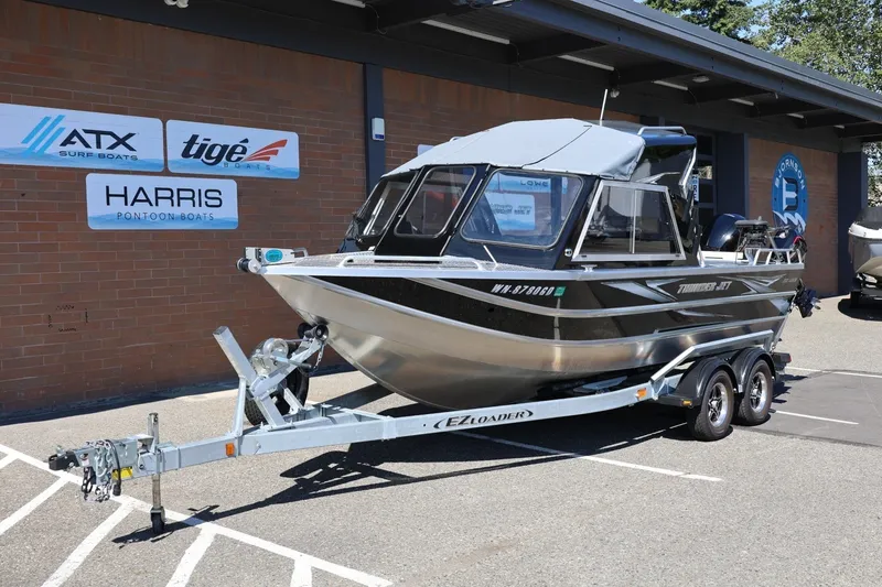 Slide: The Image of 2025 Thunder Jet 200 Luxor boat on trailer outside dealership. - 14