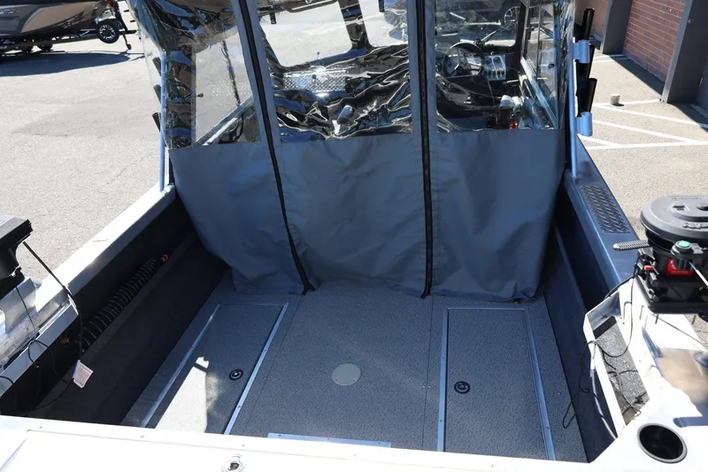 Slide: The Image of 2025 Thunder Jet 200 Luxor boat interior with covered cockpit and modern controls. - 20