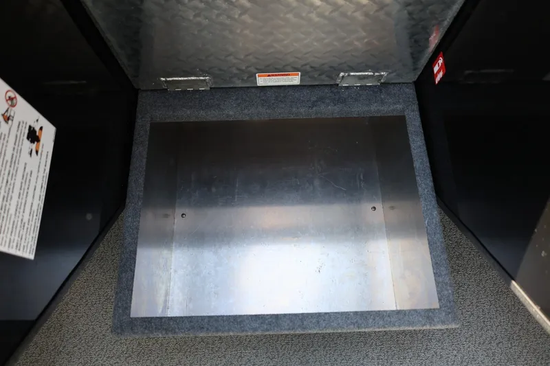Slide: The Image of Storage compartment in 2025 Thunder Jet 200 Luxor boat, featuring metal and carpeted surfaces. - 54