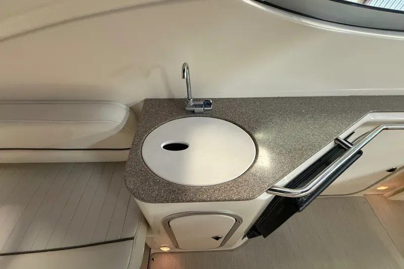 Slide: The Image of 2005 Maxum 3300 SE boat interior with sink and countertop. - 13