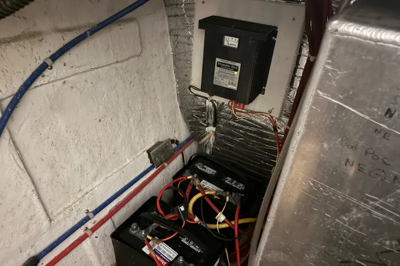 Slide: The Image of Electrical system of a 2005 Maxum 3300 SE boat with batteries and wiring. - 59