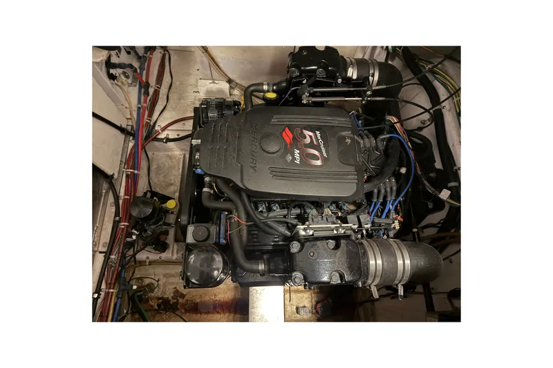 Slide: The Image of 2005 Maxum 3300 SE engine compartment with Mercury 5.0 MPI motor. - 58