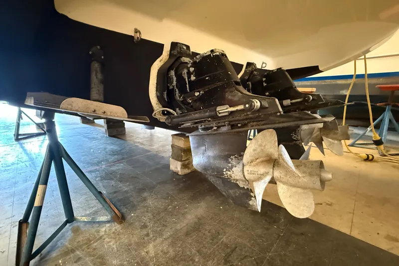 Slide: The Image of 2005 Maxum 3300 SE boat propellers and stern drive in maintenance setting. - 5