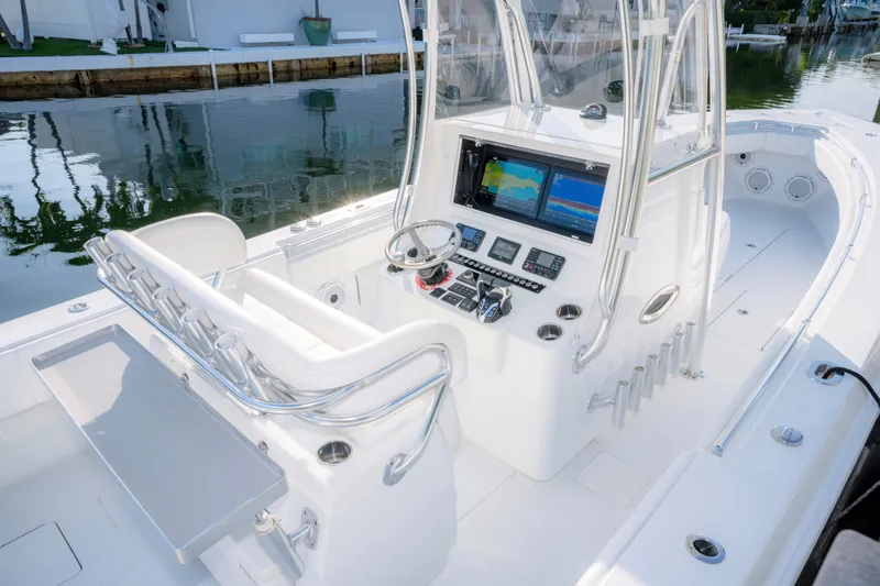 Slide: The Image of 2024 Contender 32 ST boat cockpit with advanced navigation system and sleek design. - 10