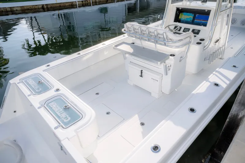 Slide: The Image of 2024 Contender 32 ST boat interior with advanced navigation system and spacious deck layout. - 12