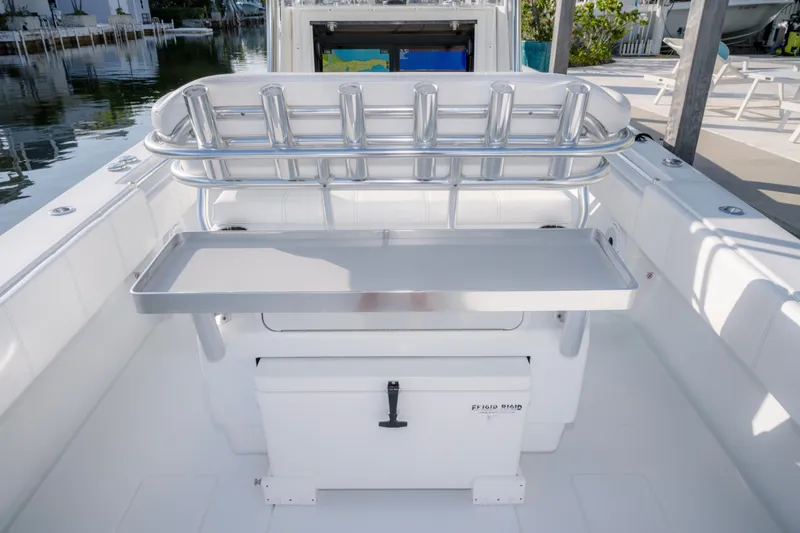 Slide: The Image of 2024 Contender 32 ST boat with rod holders and storage compartment. - 17
