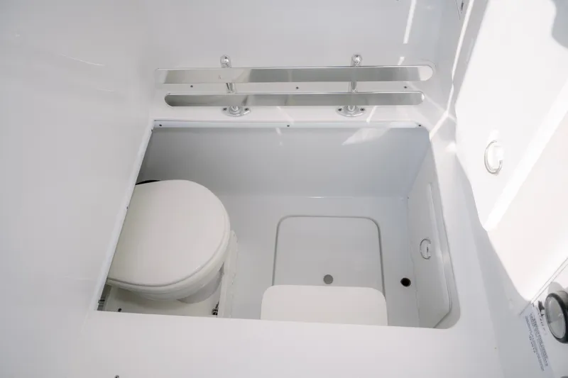 Slide: The Image of 2024 Contender 32 ST boat interior with compact marine toilet. - 19