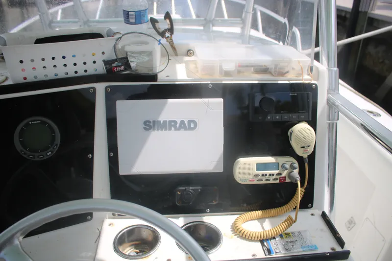 Slide: The Image of Center console of a 1996 Jupiter 31 boat with navigation and communication equipment. - 20