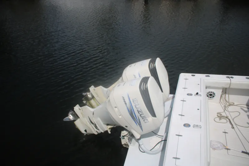 Slide: The Image of Twin Suzuki outboard motors on a 1996 Jupiter 31 Center Console boat. - 5
