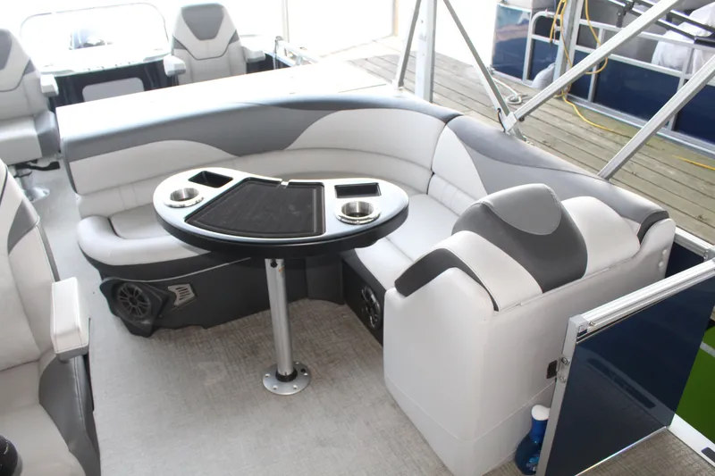 Slide: The Image of The image shows the interior of a 2024 Avalon LSZ RF 2585 with gray and white seating. - 11