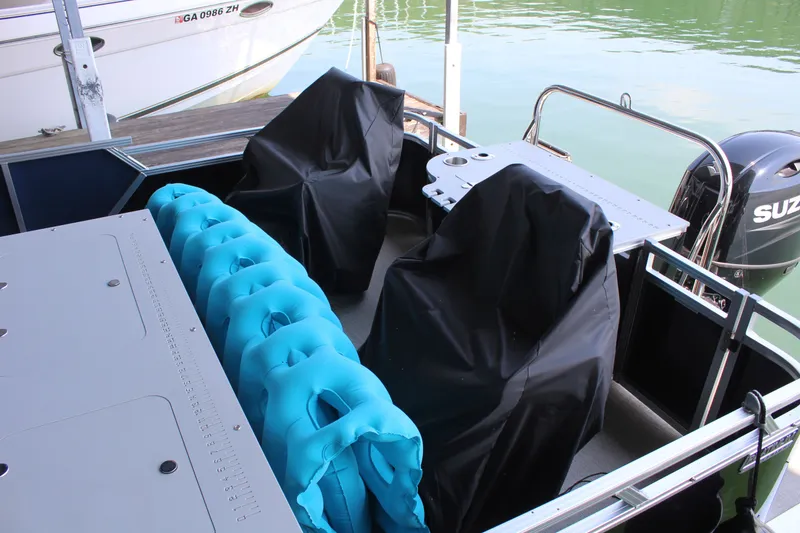 Slide: The Image of The image shows the deck of a 2024 Avalon LSZ RF 2585 with blue and black covers. - 20